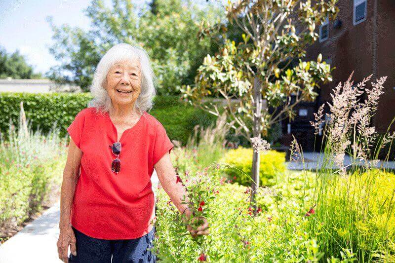 Enjoying the beautiful flowers at Davis Community